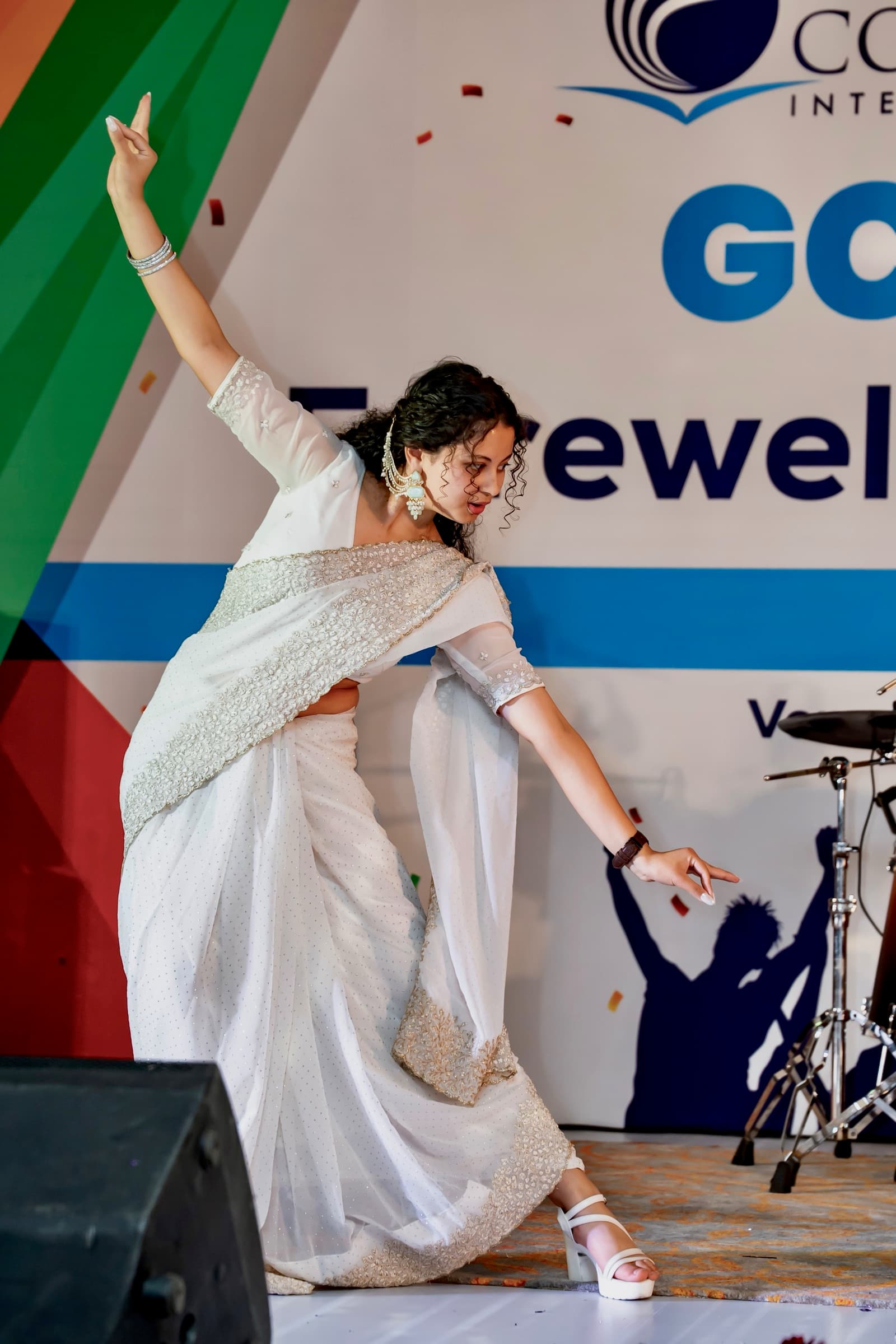 Moulikta performing Apsara Aali in a white embellished sari