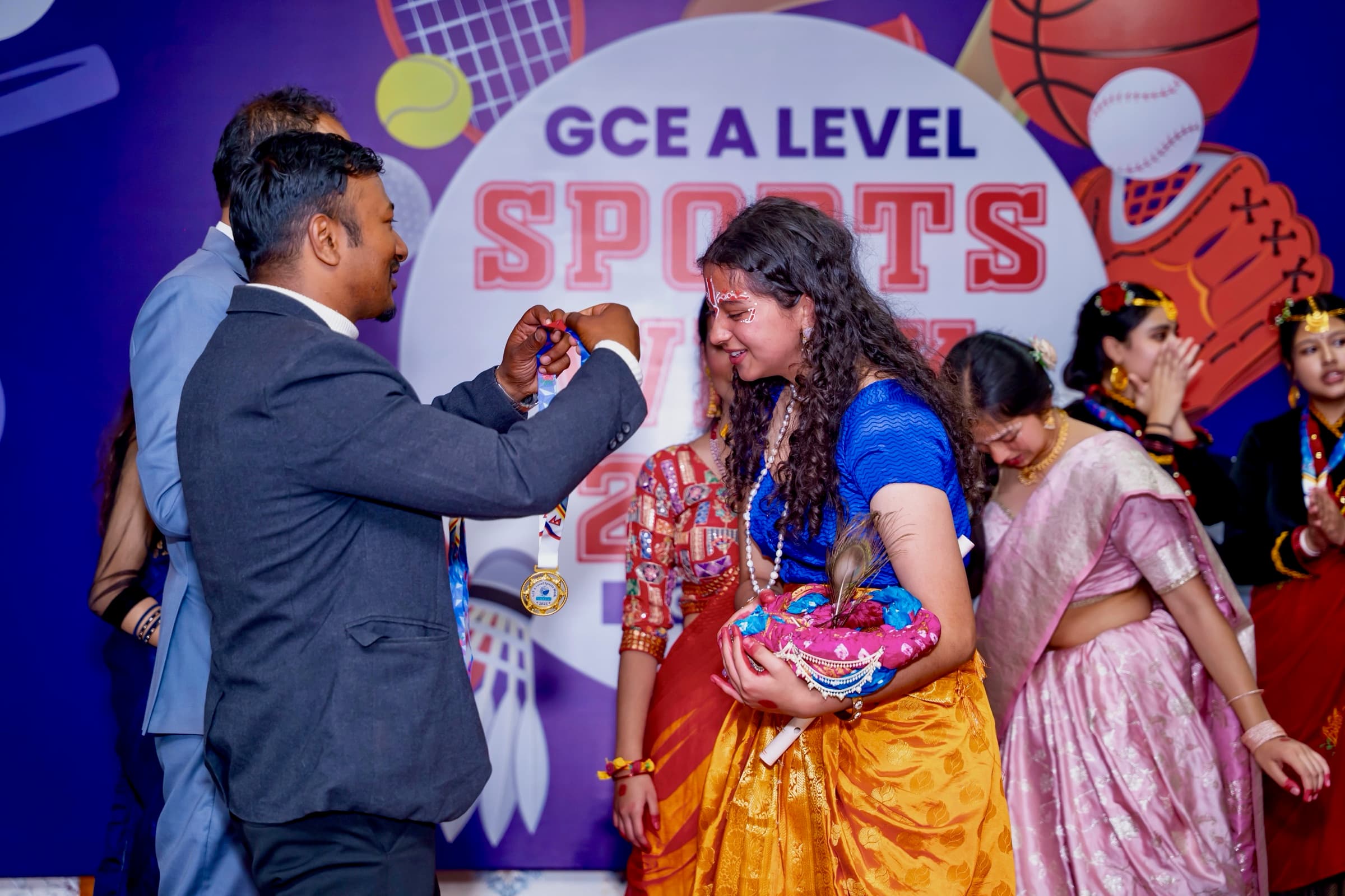 Moulikta receiving a medal for the Krishna Lila performance