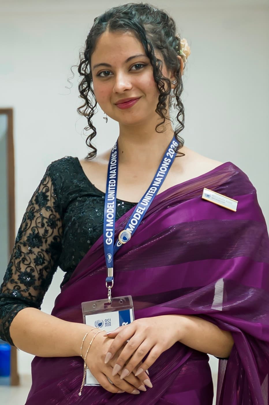 Moulikta Joshi outdoors in a dark green sari
