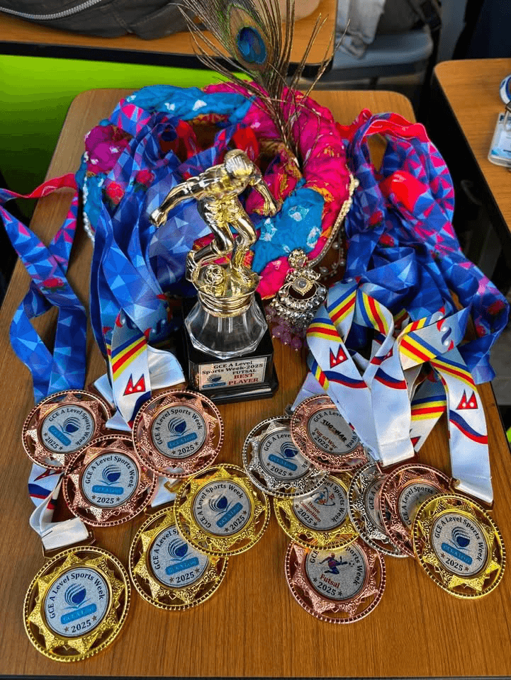 A collection of medals and trophies from Sports Week